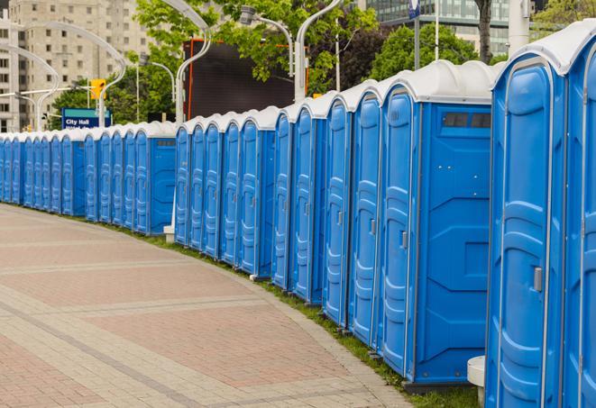 a row of sleek and modern portable restrooms at a special outdoor event in Crestwood